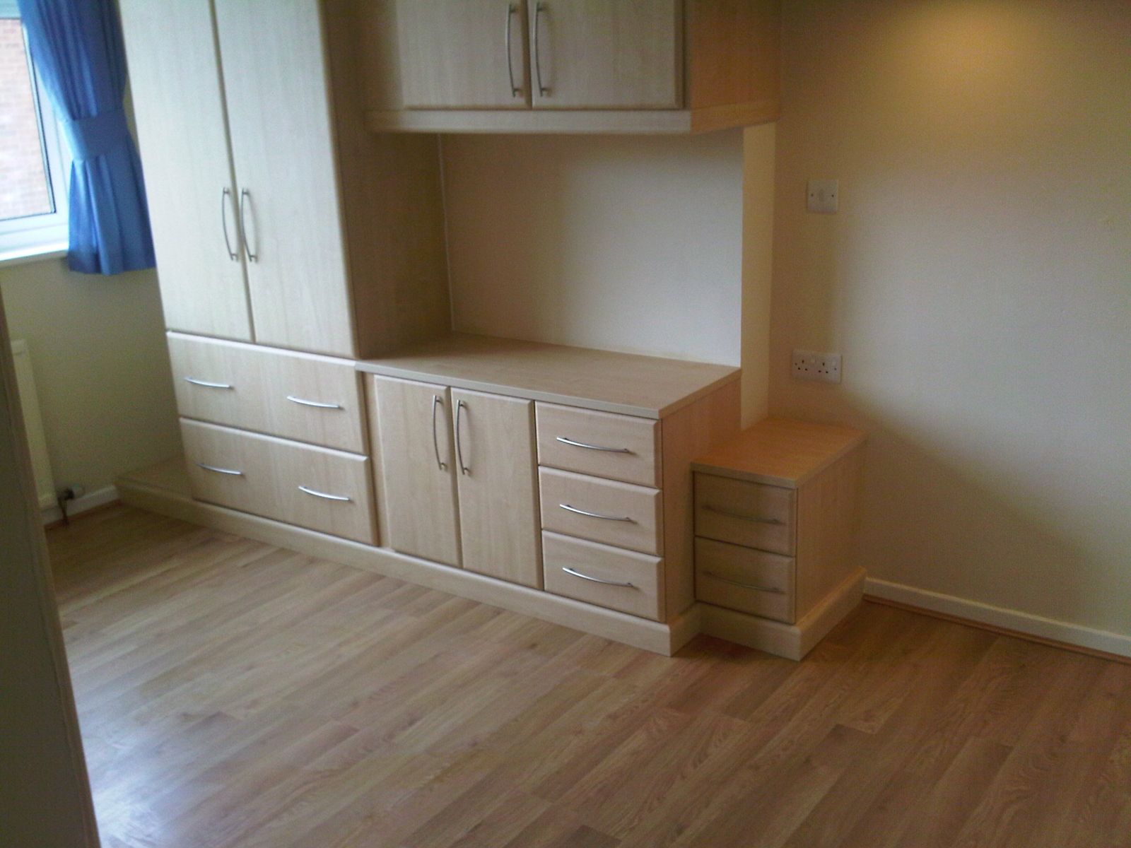 Fitted bedroom furniture with wardrobes and dressing table