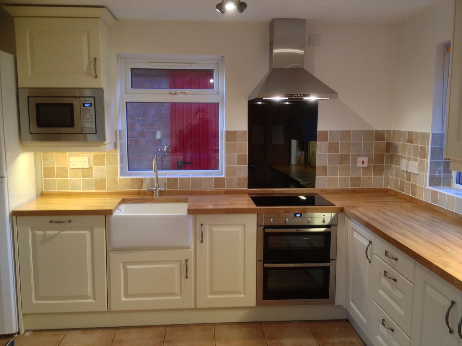 Hand-built cream shaker kitchen with Belfast sink and solid oak worktops