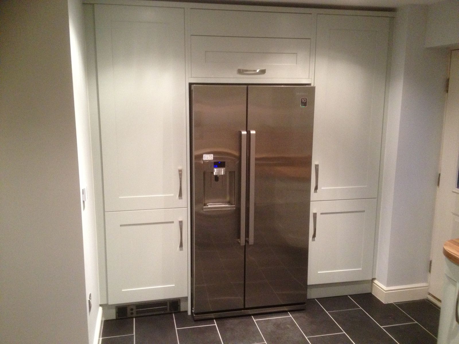 Full-height cabinetry built around an American fridge-freezer