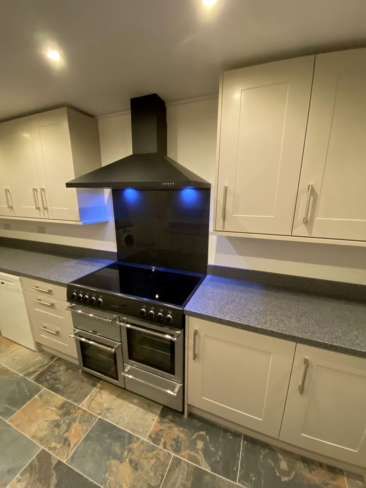 Cream shaker kitchen with range cooker