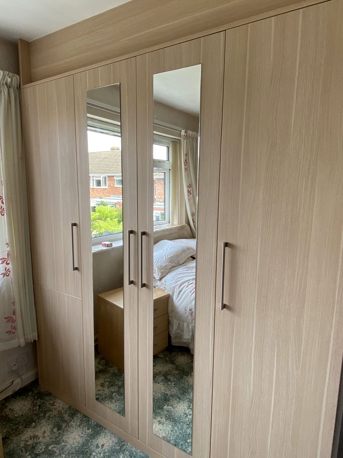 Floor-to-ceiling fitted wardrobes with mirror