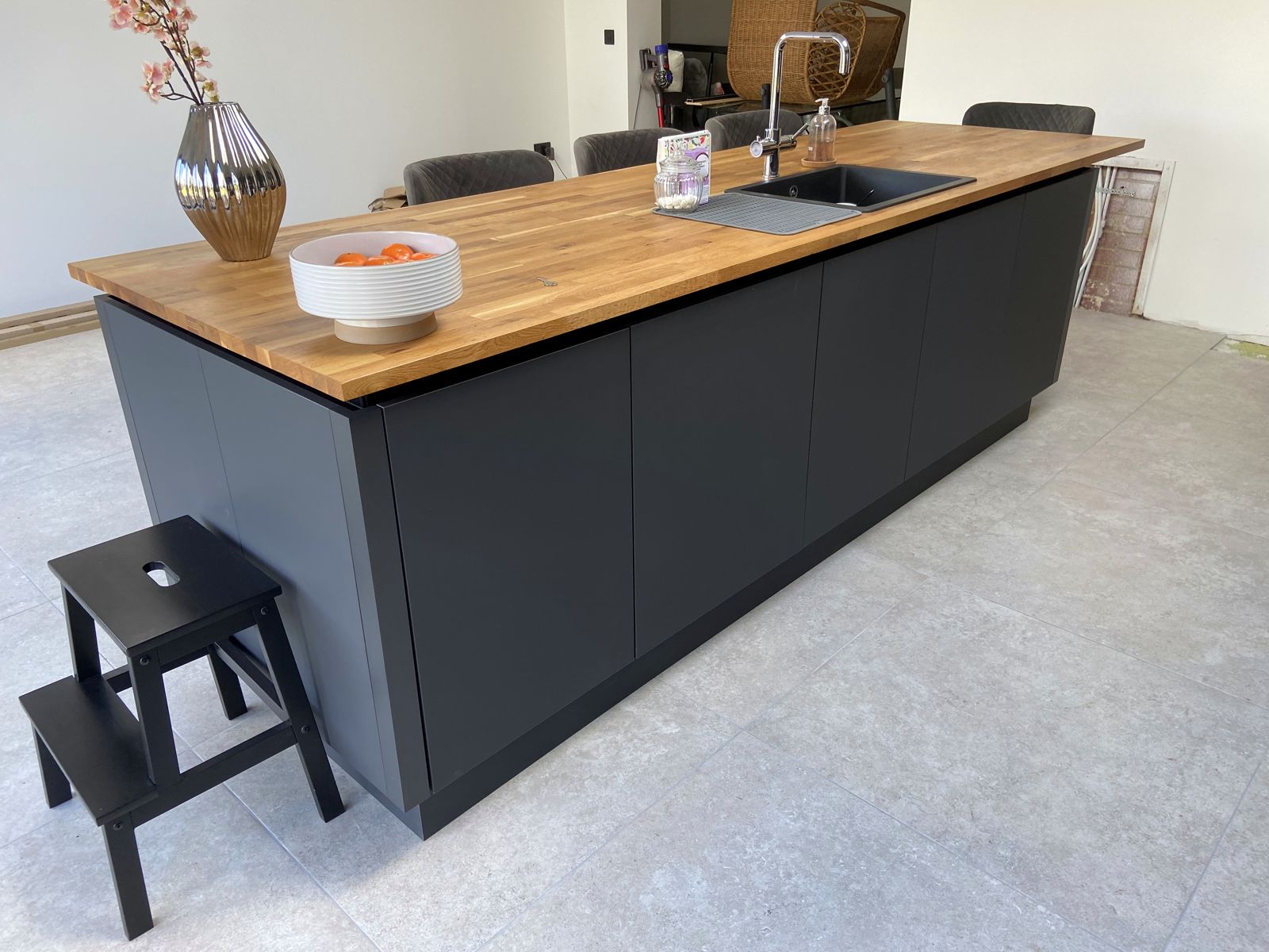 Open-plan kitchen with oak breakfast bar, another view